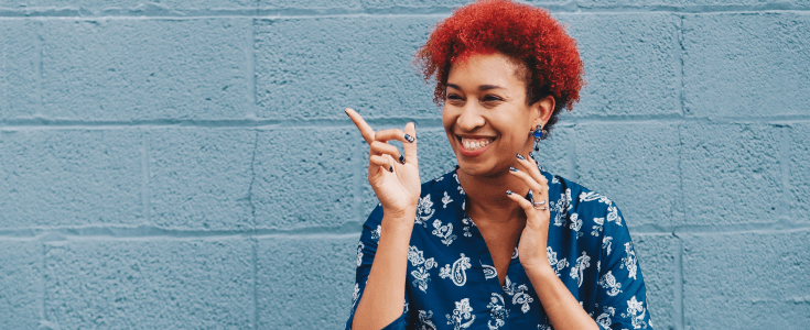 happy woman pointing and smiling