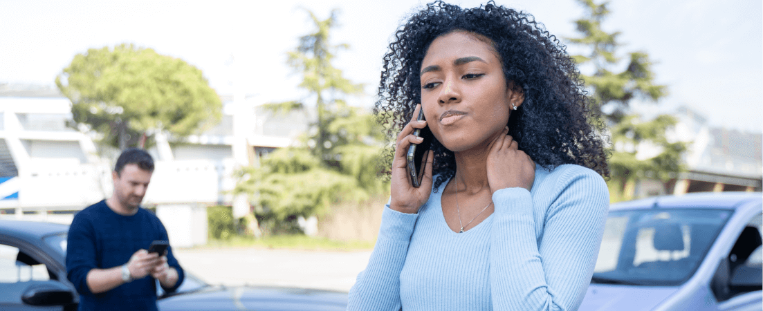 woman on phone after car accident