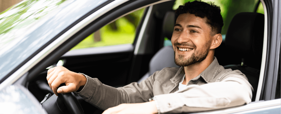 man driving a car