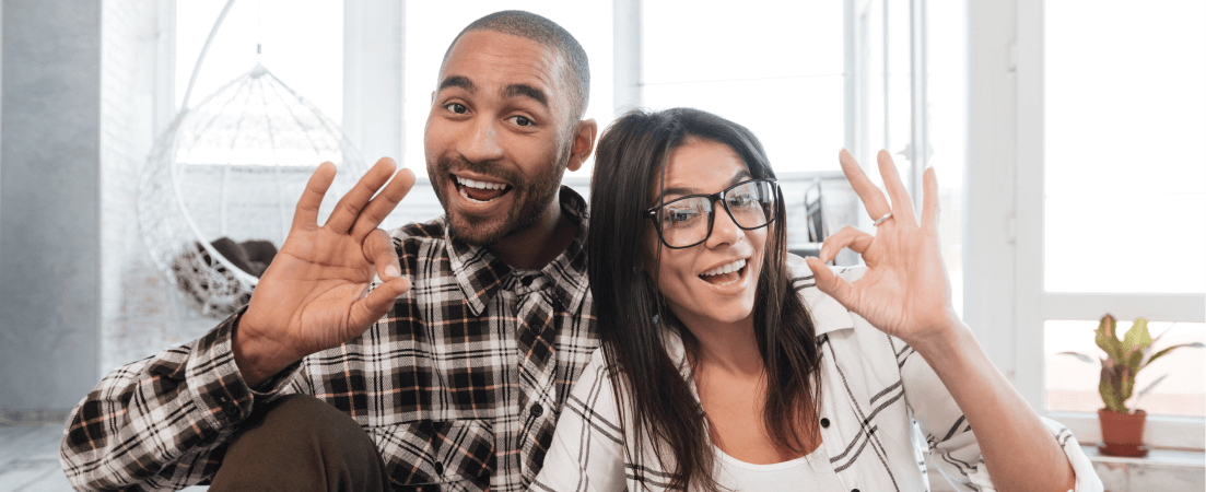positive couple doing okay sign