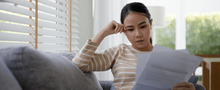 woman looks at papers