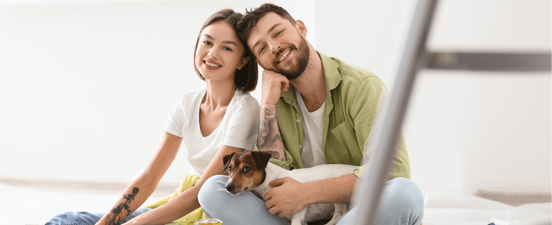 couple with dog fixing doing home improvements
