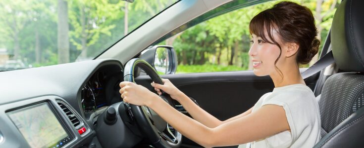A woman drives her car