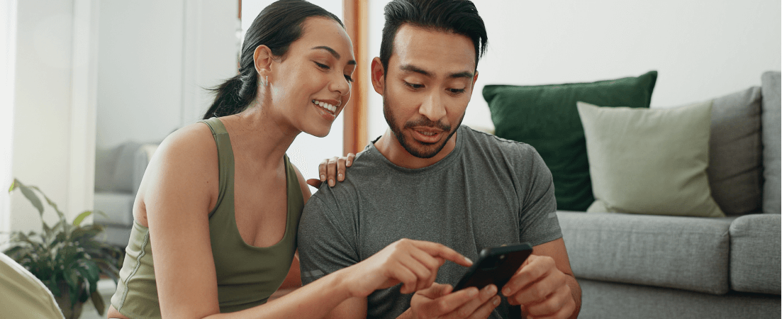 A couple looking at their phone