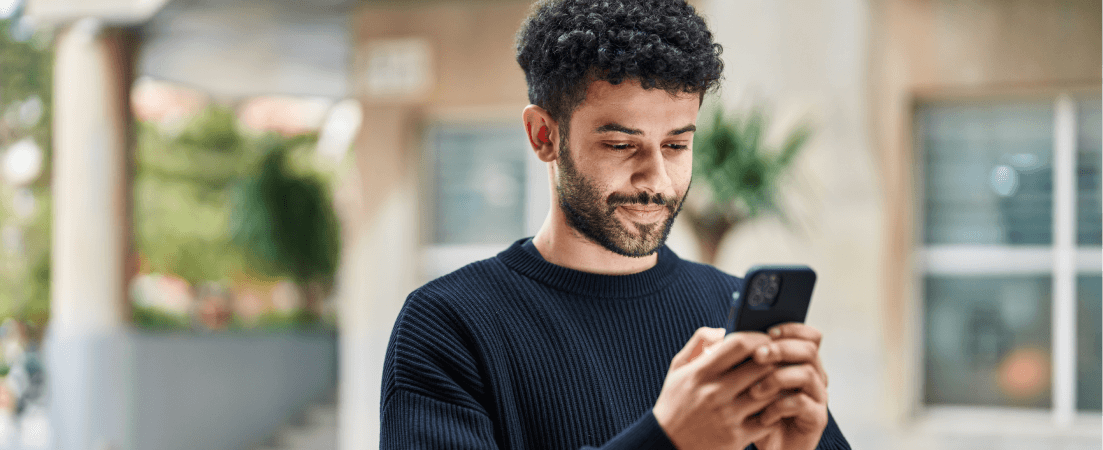 Young man looking at his phone