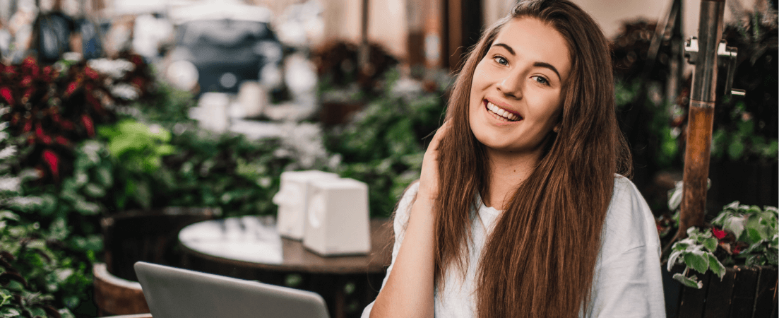 woman sitting outside in a cafe