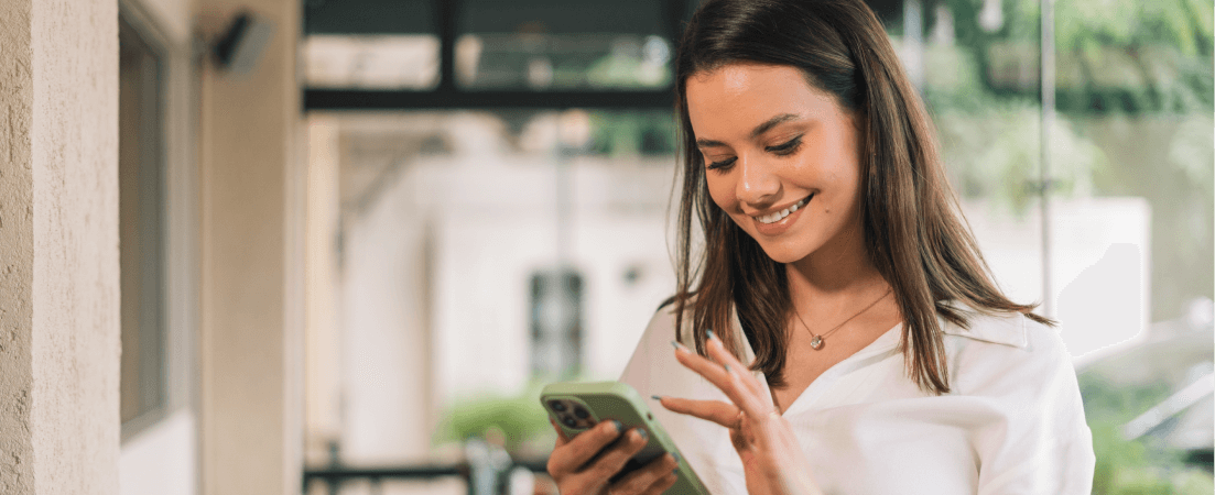 woman looks at her phone