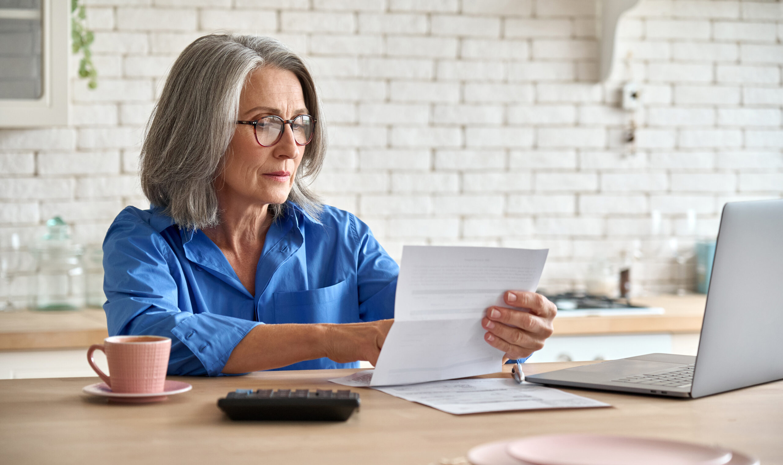 woman looking at statement with bank fees