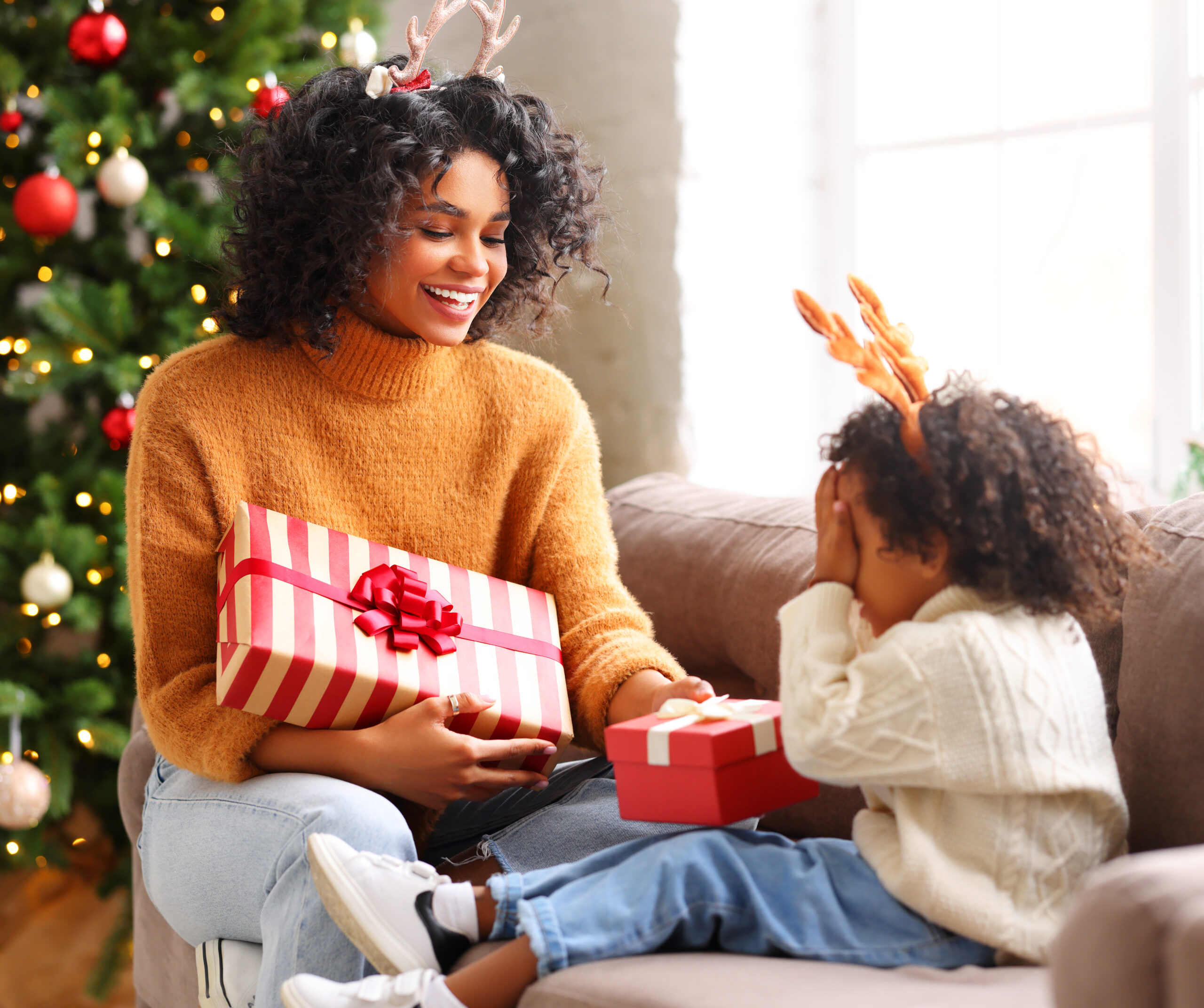 mother giving Christmas present to daughter